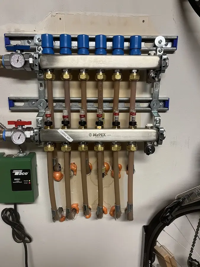 Plumber performing Water Heater Repair at a residential property in Franklin